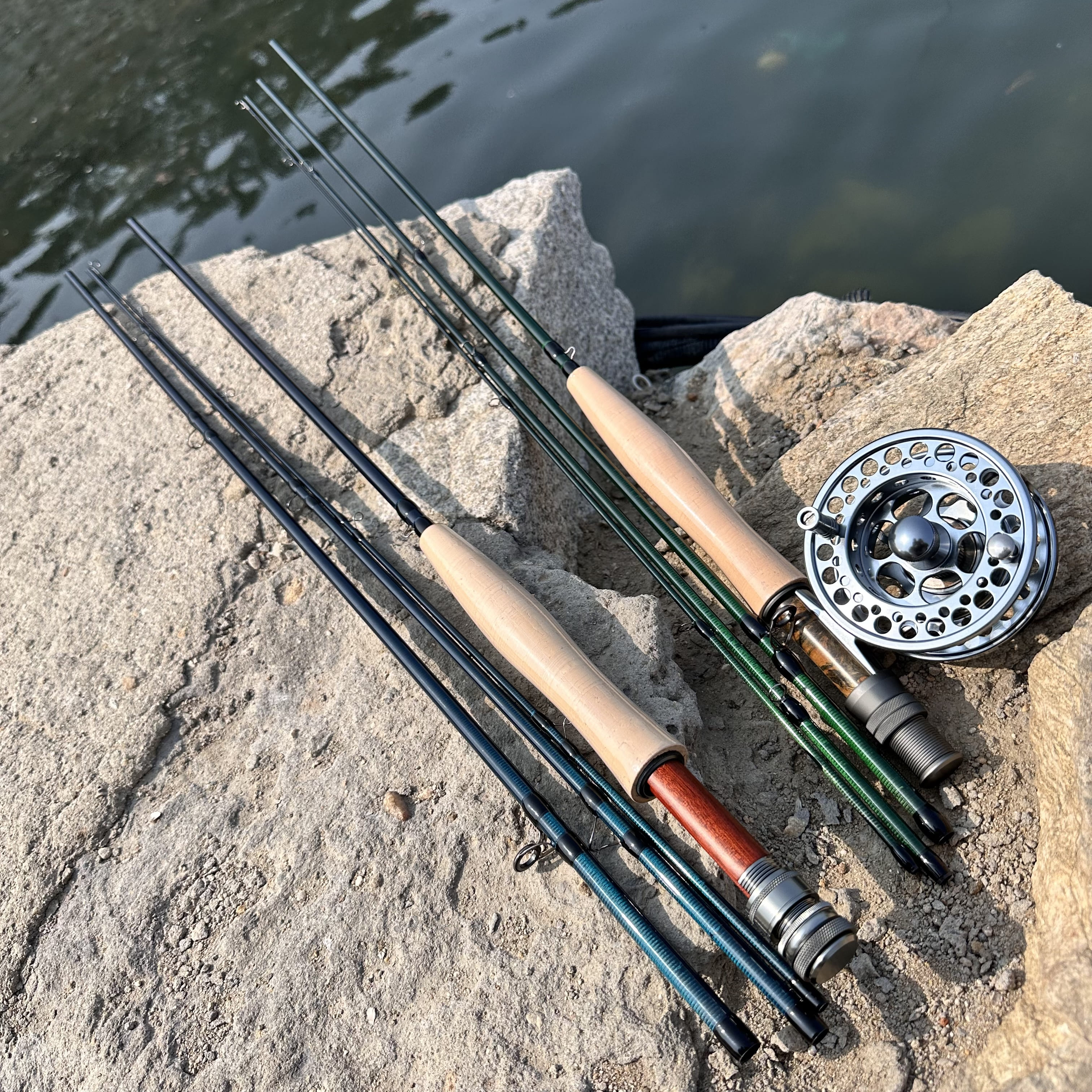 Angler casting a carbon fiber fly rod on a serene lake